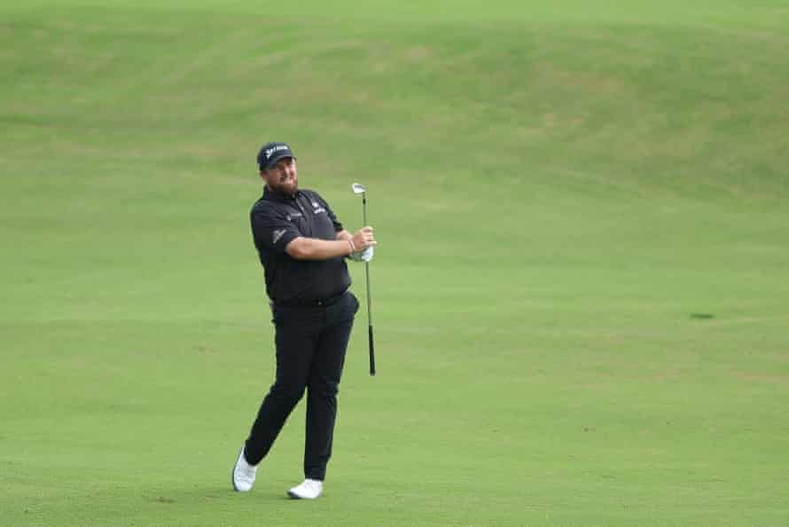 Shane Lowry plays his second shot on the 18th.