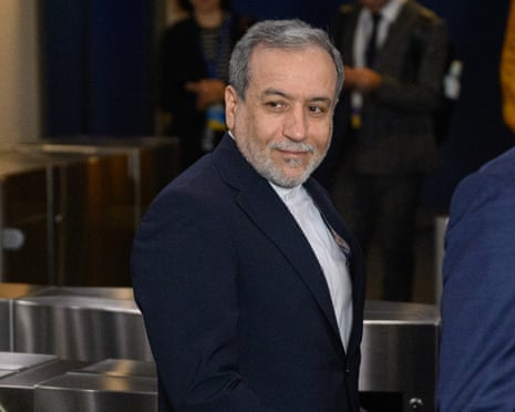 Abbas Araghchi smiling for pictures as he arrives at the UNGA.