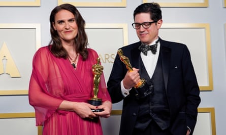 Alice Doyard and Anthony Giacchino pose with the Oscar in the press room.