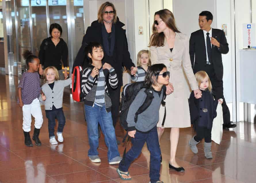 Brad Pitt, Angelina Jolie and their six children Maddox, Pax, Zahara, Shiloh, Knox, and Vivienne arrive at Haneda International Airport on November 8 in Tokyo, Japan.