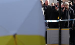 Theresa May talks with Wiltshire Police’s chief constable Kier Pritchard as she is shown the police tent covering the bench in Salisbury where Sergei Skripal and his daughter Yulia were discovered on March 4