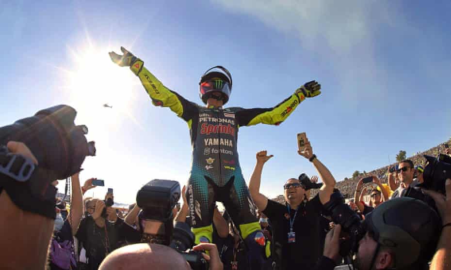 Valentino Rossi salutes the crowd after his final race.