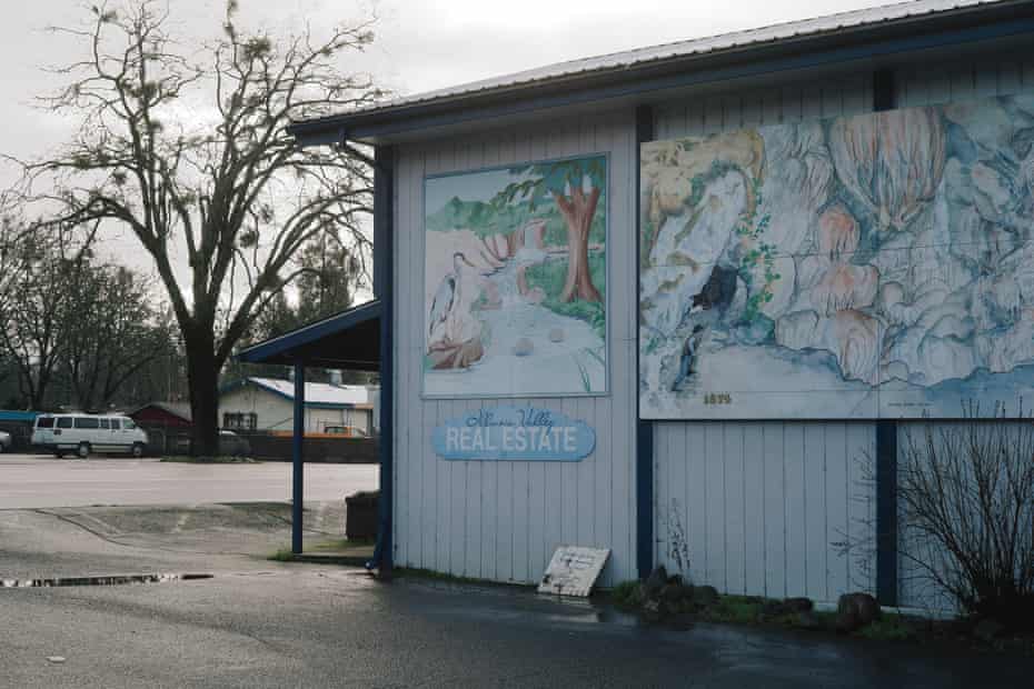 View of a real estate office with a mural