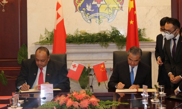 China's Foreign Minister Wang Yi and Tonga's Prime Minister Siaosi Sovaleni sign agreements during Wang Yi's official visit to the country in May.