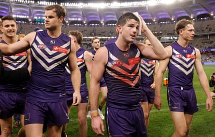 Andrew Brayshaw and Dockers teammates leave the field after beating the Hawks at Optus Stadium