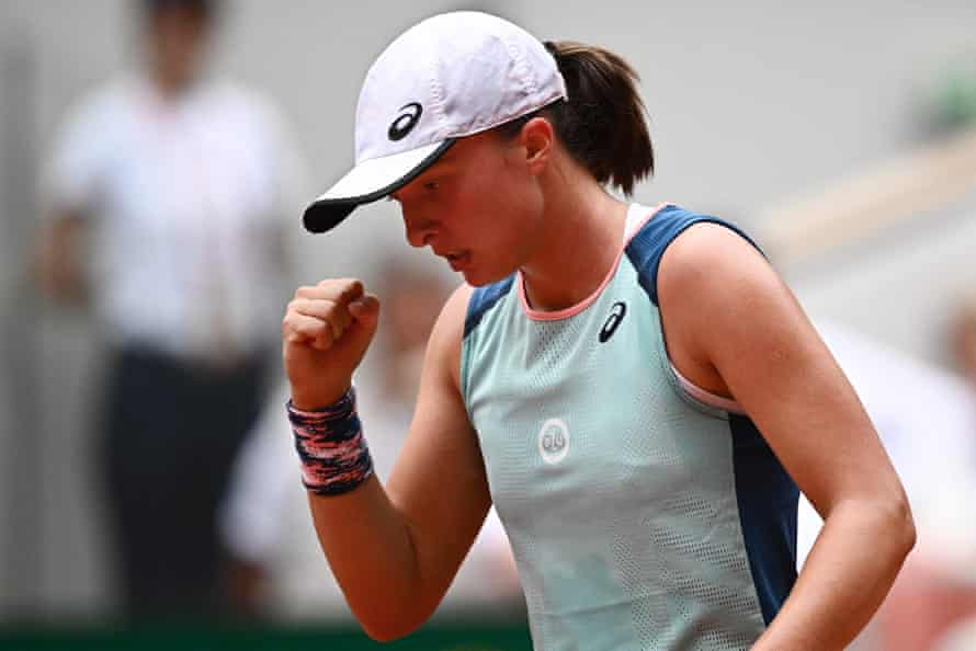 Iga Swiatek reacts as she plays against Coco Gauff.