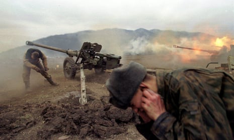 Russian soldiers fire at rebel positions near the village of Duba-Yurt, during the second Chechen war in 2000.