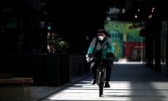 UK Remains On Lockdown Due To Coronavirus As Infection Rate Appears To Slow<br>LONDON, ENGLAND - APRIL 07: A Deliveroo cyclist wearing a mask makes his way through the Westfield Stratford Shopping Centre on April 07, 2020 in London, England. There have been around 50,000 reported cases of the COVID-19 coronavirus in the United Kingdom and 5,000 deaths. The country is in its third week of lockdown measures aimed at slowing the spread of the virus. (Photo by Alex Pantling/Getty Images)