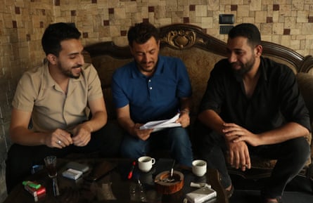 Malek Moustafa (centre) with fellow activists Ahmed al-Homsi (left) and Mohammed Katab (right) in the office of the Tadamon Coordination Committee.