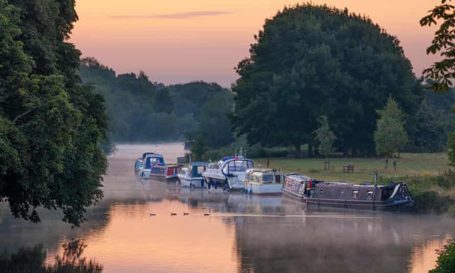 Boats in the dawn mist upriver at Abingdon-on-Thames, part of the stretch where Three Men in a Boat is set.