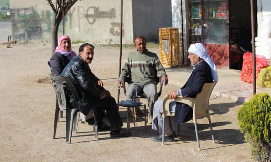 Villagers outside a local shop in northern Syria