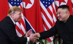 Donald Trump shakes hands with Kim Jong-un in February 2019. 
