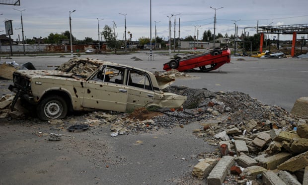 Destroyed cars, damaged by Russian shelling in Saltivka, a northern district of Kharkiv.