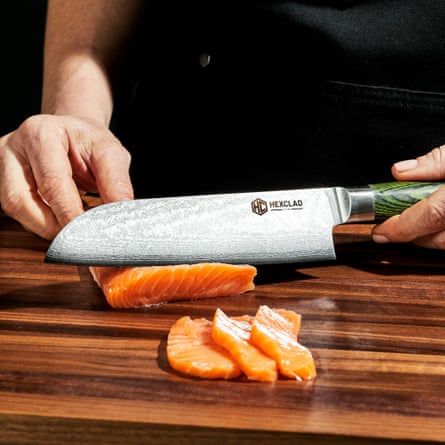 close-up of person cutting up salmon
