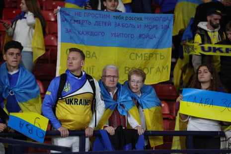 Ukraine fans look dejected after the final whistle.