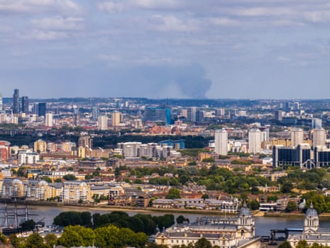 A large warehouse fire near St Albans can be seen over the London skyline.