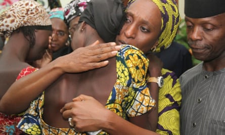 Nigeria’s vice-president, Yemi Osinbajo, right, looks on as his wife Dolapo comforts one of the 21 girls from Chibok freed by Boko Haram in 2016.