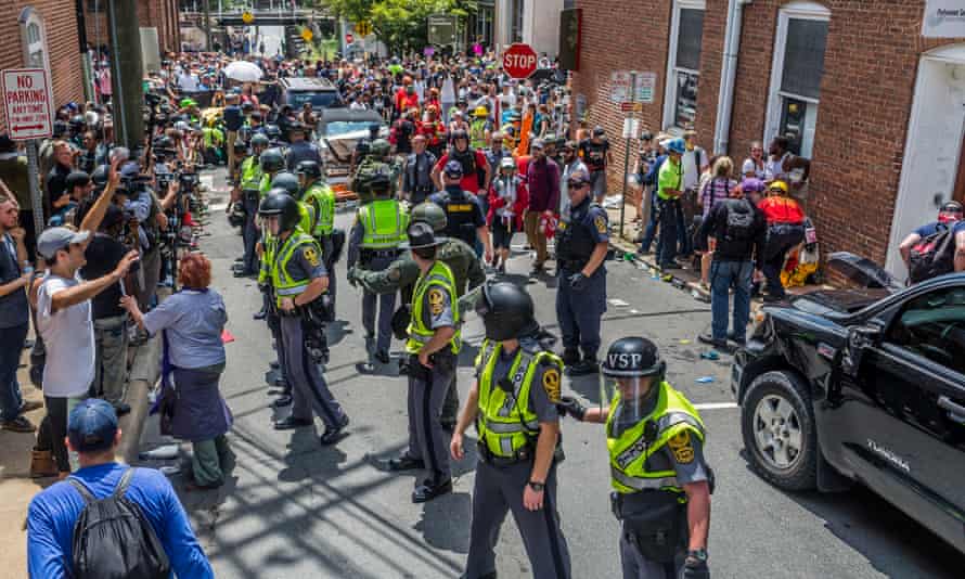 Police stand between white supremacists and anti-fascist protesters in Charlottesville.