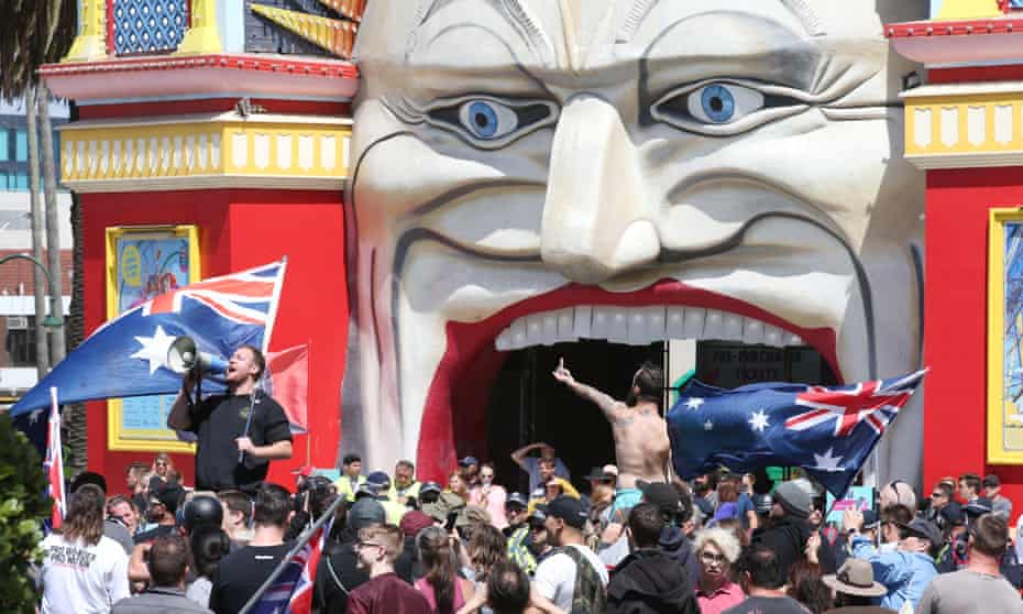 Rally at St Kilda beach: far-right activists protest in front of Luna park fun fair in Melbourne on Saturday.