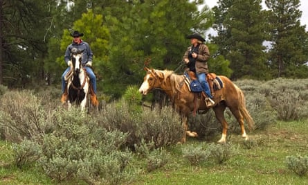 US Secretary of the Interior, Ryan Zinke, left, takes a horse ride with local ranchers during a tour of the Bears Ears National Monument in May 2017.