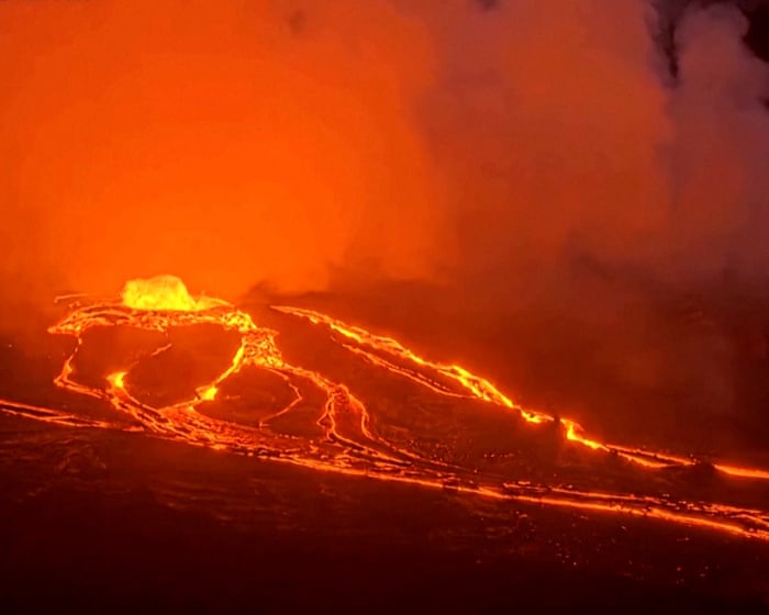 Hawaiian volcano spews rivers of lava in dramatic burst of activity – video
