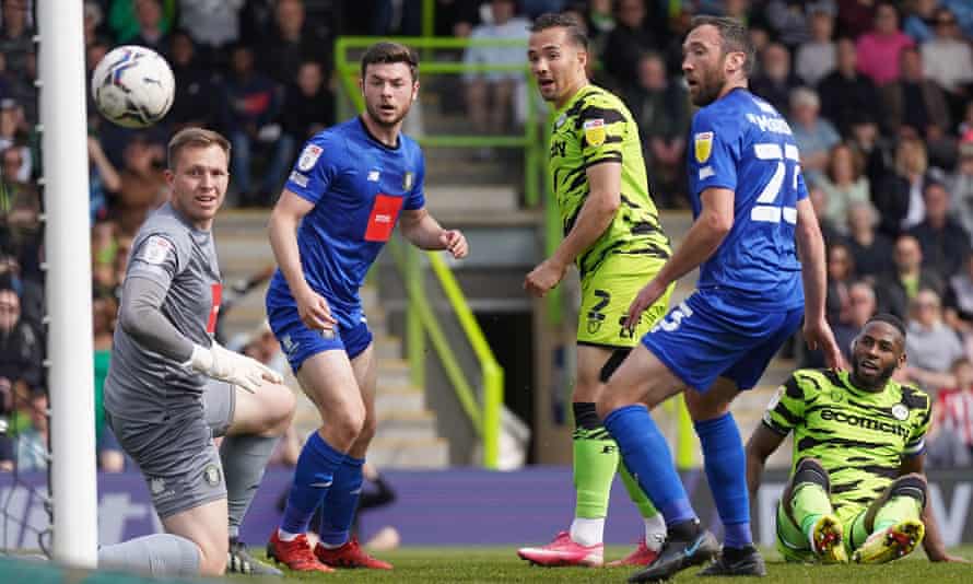 Forest Green's Kane Wilson (centre) hits a post during Forest Green's home game against Harrogate.