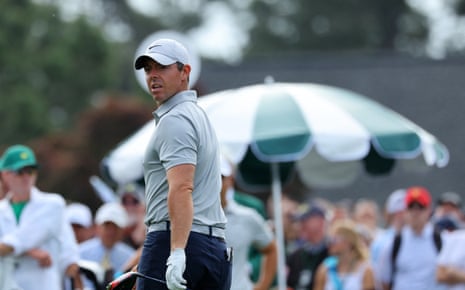 Rory McIlroy watches his tee shot on the 1st.