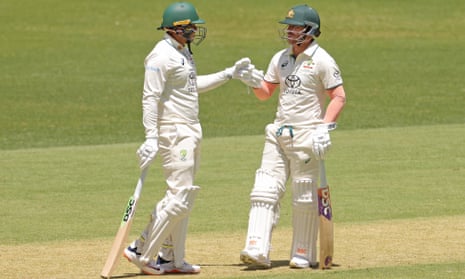 Usman Khawaja and David Warner celebrate getting to lunch unscathed on Day 1.