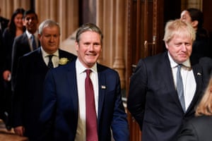 Keir Starmer and Boris Johnson proceed through the members’ lobby ahead of the state opening of parliament in London, UK