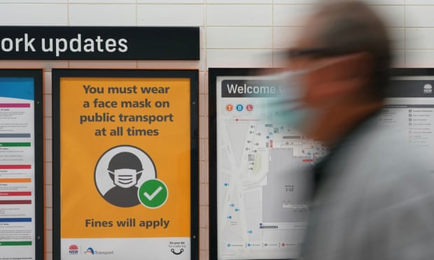 A sign at Central Station on Wednesday mandates mask-wearing on public transport as greater Sydney battles a Covid outbreak. Laboratory studies have found particles of the virus can linger in the air in aerosolised form for up to 16 hours.