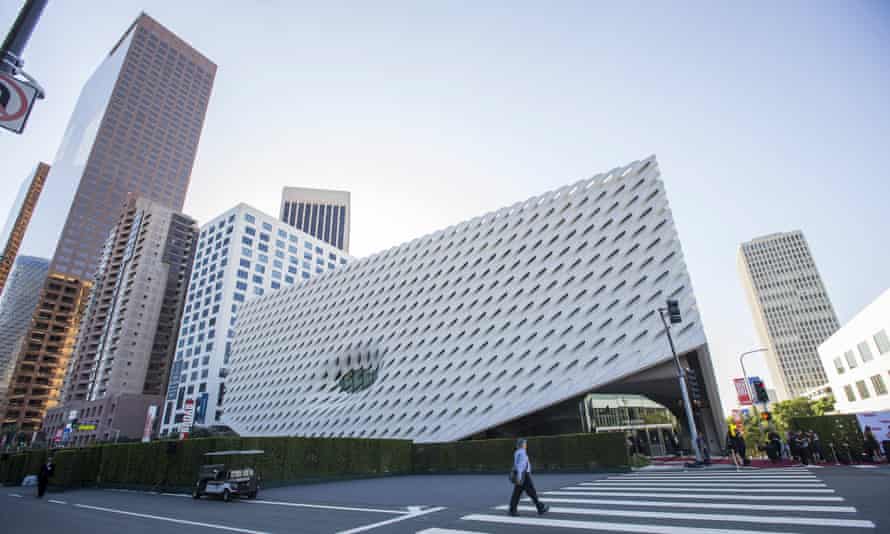 A person crosses the street by The Broad Museum prior to a dinner gala in Los Angeles, California September 17, 2015. The new museum built by philanthropists Eli and Edythe Broad, featuring their collection of modern art, will open to the public on September 20. REUTERS/Mario Anzuoni