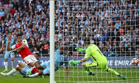 Alexis Sanchez, left, scores Arsenal’s second goal in their FA Cup semi-final defeat of Manchester City last season.