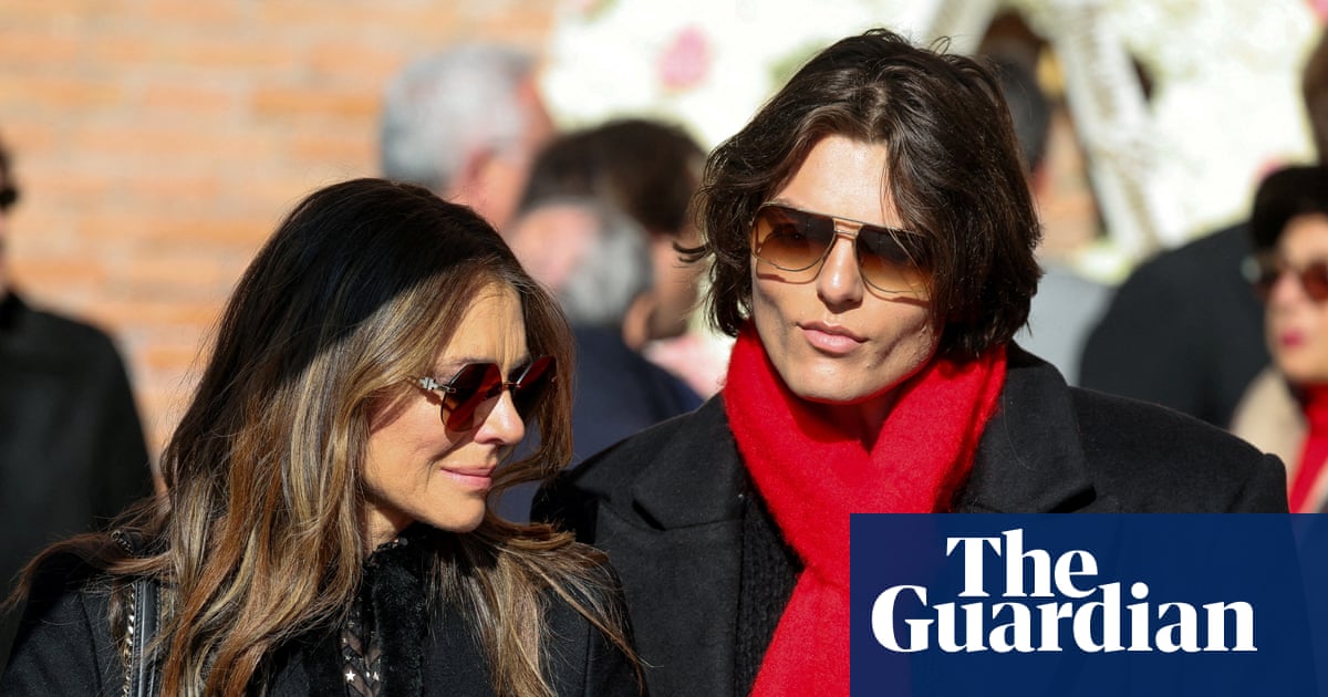 As stars wear black at Valentino’s funeral, tributes are dressed in red
