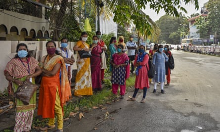 Women wear masks in Kochi, Kerala state. The state had been praised for its initial response to the virus.