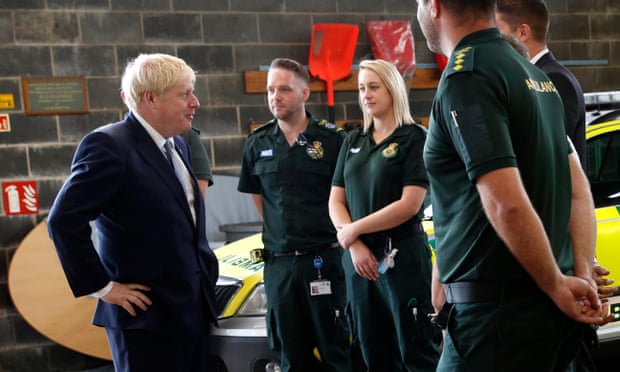 Boris Johnson chats with NHS ambulance crews during a visit to Pilgrim hospital in Boston, Lincolnshire