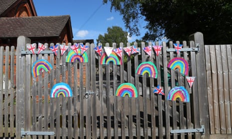flags and rainbows on closed school gate