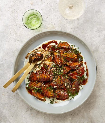 Yotam Ottolenghi’s grilled sweet potatoes with hot sauce butter, chive sour cream and pumpkin seeds.