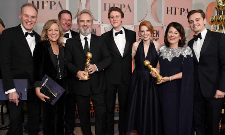 Sam Mendes, fourth left, and Pippa Harris, second right, with the cast and crew of 1917, winner of the Best Motion Picture - Drama at the 77th annual Golden Globe awards this month