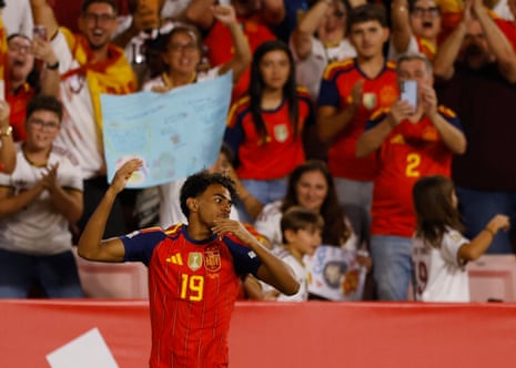Spain's Lamine Yamal celebrates scoring their first goal.