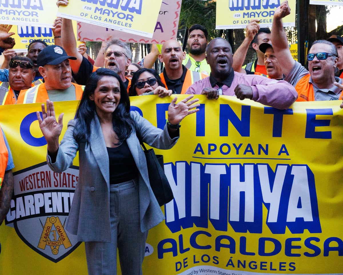 Nithya Raman, Los Angeles mayoral candidate and city councilmember, takes photos with members of the Western State Carpenters before a debate on 19 August 2026.