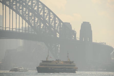 The Sydney Harbour Bridge is shrouded in smoke haze as bushfires burn in 2021