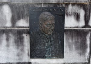 The plaque celebrating Cardinal George Pell’s tenure as Archbishop of Sydney at St Mary’s Cathedral is seen splattered with green paint in Sydney.