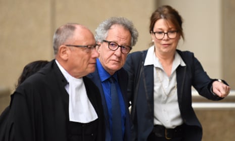 Actor Geoffrey Rush (centre) arrives to give evidence in his defamation trial at the federal court in Sydney on Monday.