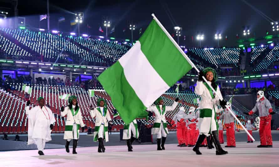 Flag bearer Ngozi Onwumere of Nigeria and teammates enter the stadium.