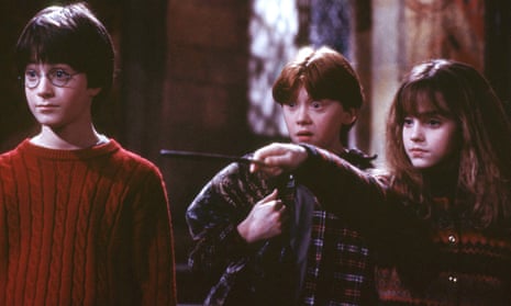 Harry Potter and the Philosopher’s Stone cast (L-R) Daniel Radcliffe (Harry Potter), Oliver Wood played by Sean Biggerstaff and Emma Watson (Hermione Grainger).