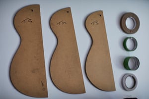 The guitar components cut out from wood