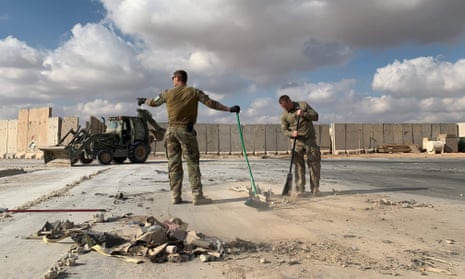 US soldiers clear rubble at Ain al-Asad military airbase in the western Iraq province of Anbar on 13 January. (FILES) A file picture taken on January 13, 2020 during a press tour organized by the US-led coalition fighting the remnants of the Islamic State group, shows US soldiers clearing rubble at Ain al-Asad military airbase in the western Iraqi province of Anbar. - Nearly three dozen US troops suffered traumatic brain injuries or concussion in the recent Iranian air strike on a military base in Iraq housing American personnel, the Pentagon said on January 24, 2020. “Thirty-four total members have been diagonosed with concussions and TBI (traumatic brain injury),” Pentagon spokesman Jonathan Hoffman told reporters. (Photo by Ayman HENNA / AFP) (Photo by AYMAN HENNA/AFP via Getty Images)