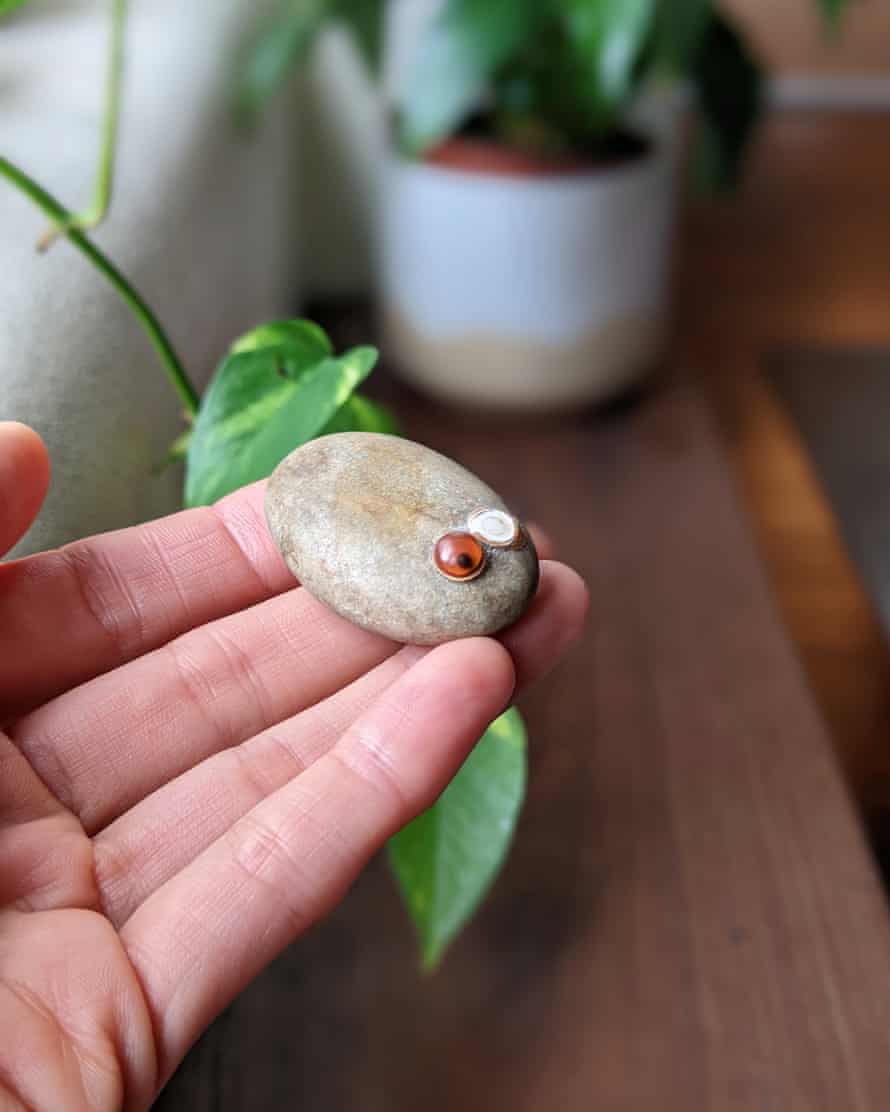 Kumi Taguchi holds the pet rock she inherited from her Japanese father