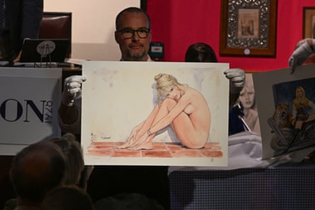 A nude portrait of Bardot is held up