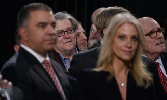 Stephen Bannon, center left, back, campaign CEO for Republican presidential candidate Donald Trump, looks on as Trump speaks during a campaign rally, in Grand Rapids, Michigan.